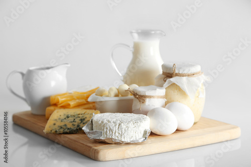 Wallpaper Mural Set of fresh dairy products on wooden table, on white background Torontodigital.ca