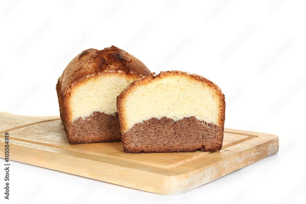Delicious sweet cake bread on wooden cutting board isolated on white Delicious sweet cake bread on wooden cutting board isolated on white