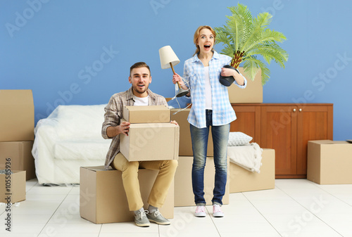 Happy young couple moving i...