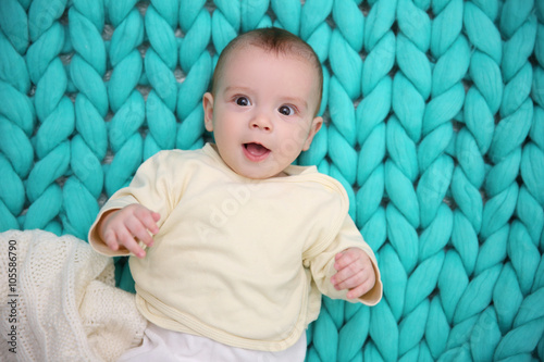 Lovely baby with white plai...