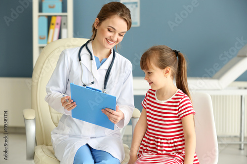 Doctor and little girl in t...