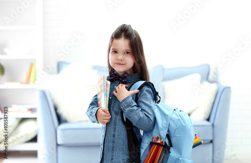 Little girl with blue back ...