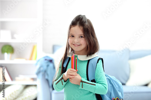 Little girl with blue back ...