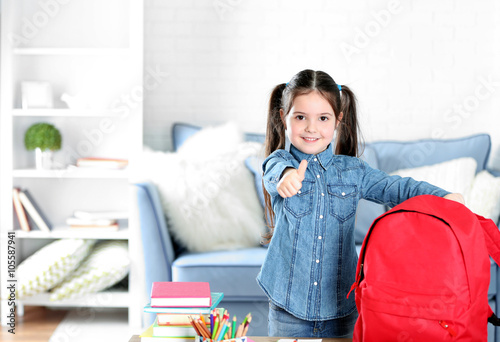 Little girl with red back p...