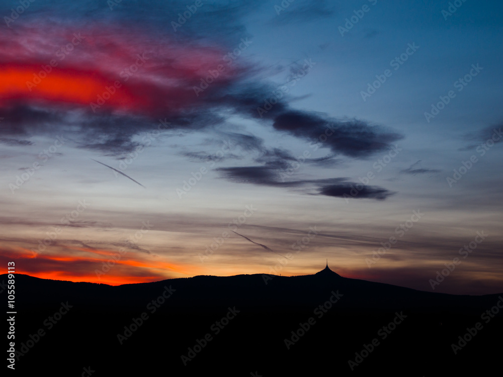Dramatic sunset sky with Jested ridge silhouette