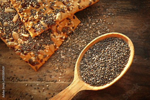 Biscuits with chia seeds on wooden background