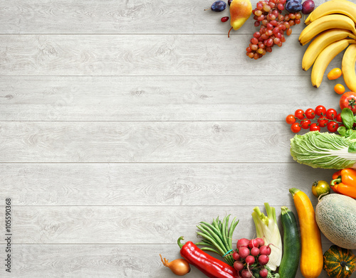 Fototapeta Naklejka Na Ścianę i Meble -  Healthy food background. Studio photo of different fruits and vegetables on white wooden table. High resolution product.
