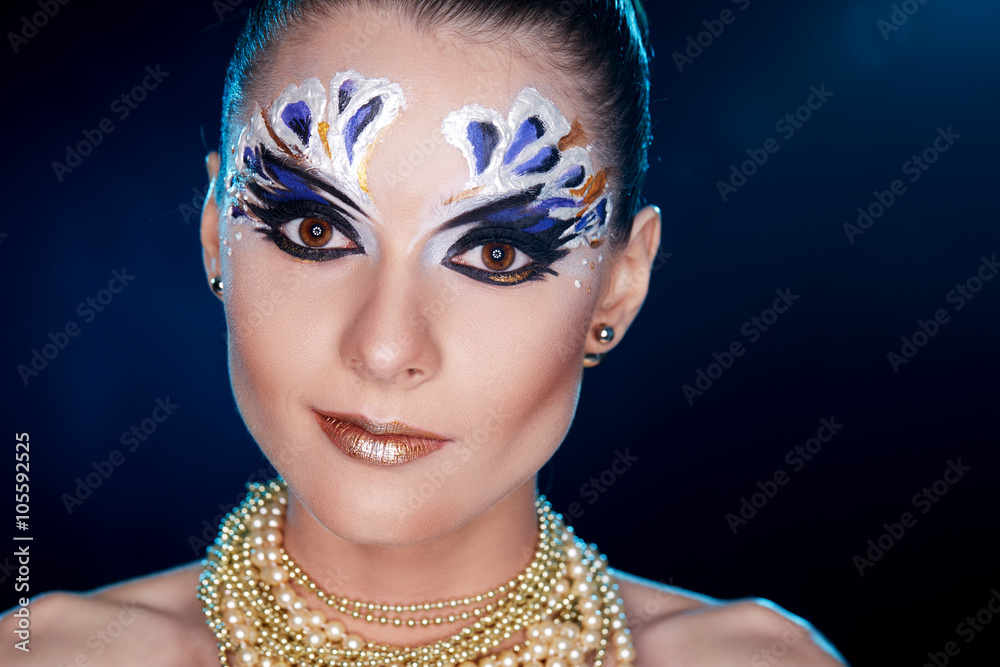 Young woman looking at the camera with fantasy make up face art studio shot. Copy space. High resolution
Young woman looking at the camera with fantasy make up face art studio shot. Copy space. High resolution