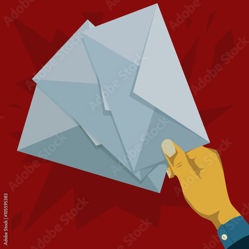Hand is holding three pieces of envelopes