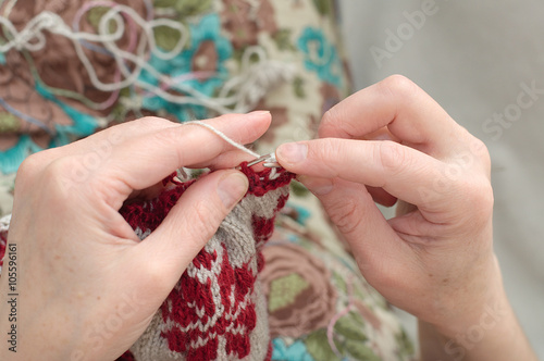 woman hands needle knitting photo