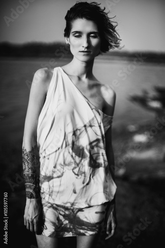 beautiful unusual woman posing in sea scenery 