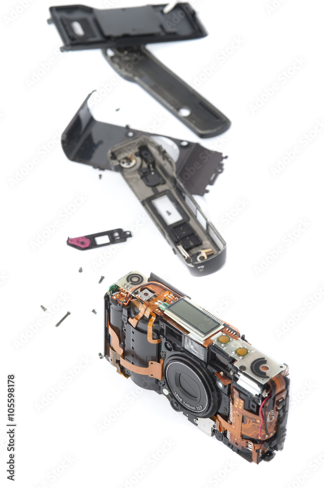 Disassembled pocket camera with loose pieces