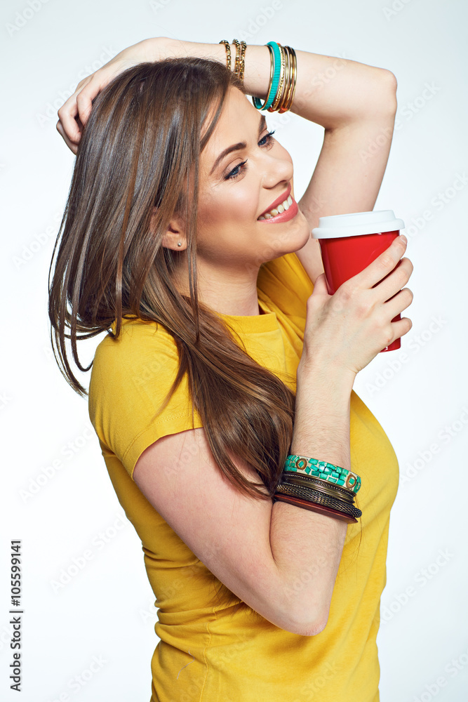 Smiling girl holding coffee cup casual dressed Smiling girl holding coffee cup casual dressed