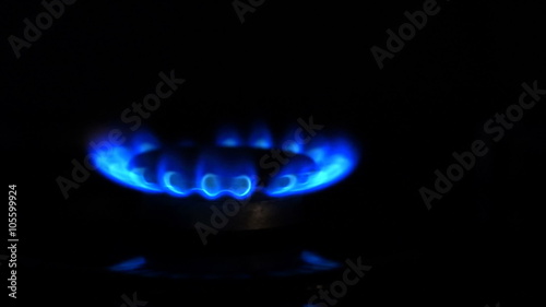 Natural gas inflammation from kitchen stove, dark shot