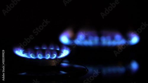 Close up of two gas burners, focusing from one to another