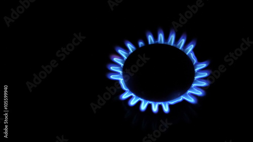 Moving around over kitchen gas stove while burners are turned on