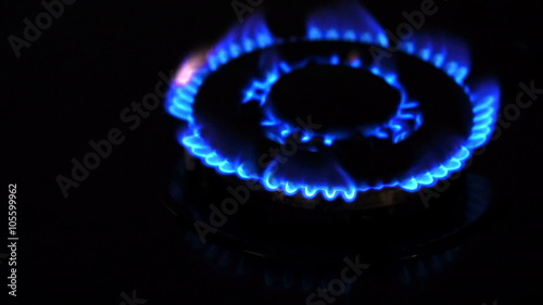 Natural gas inflammation from kitchen stove, dark shot