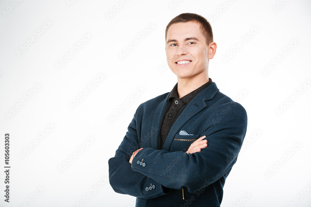 Cheerful businessman standing with arms folded Cheerful businessman standing with arms folded