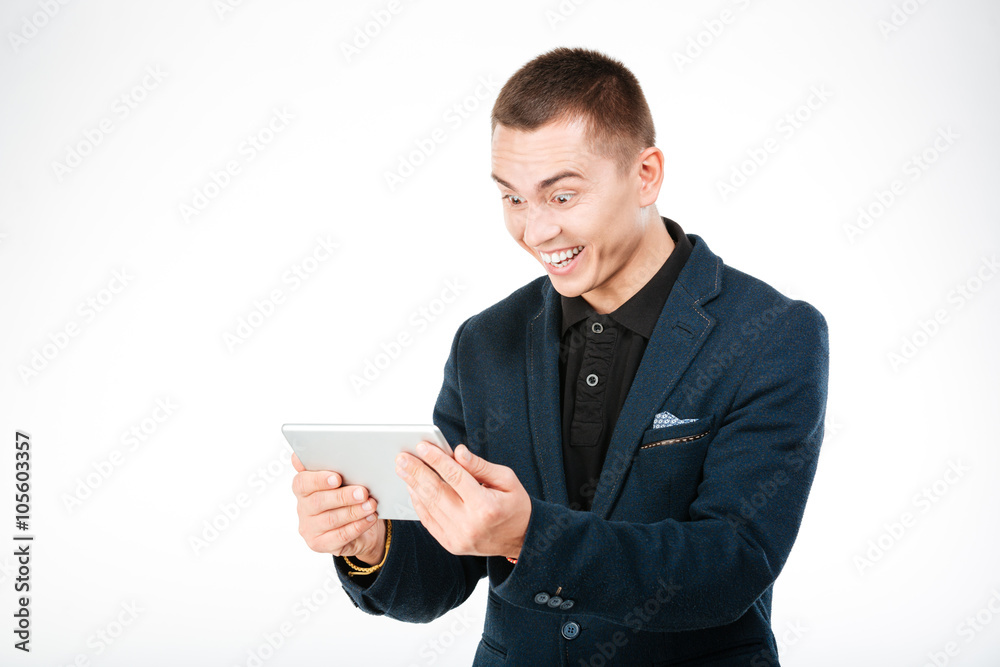 Cheerful businessman using tablet computer Cheerful businessman using tablet computer