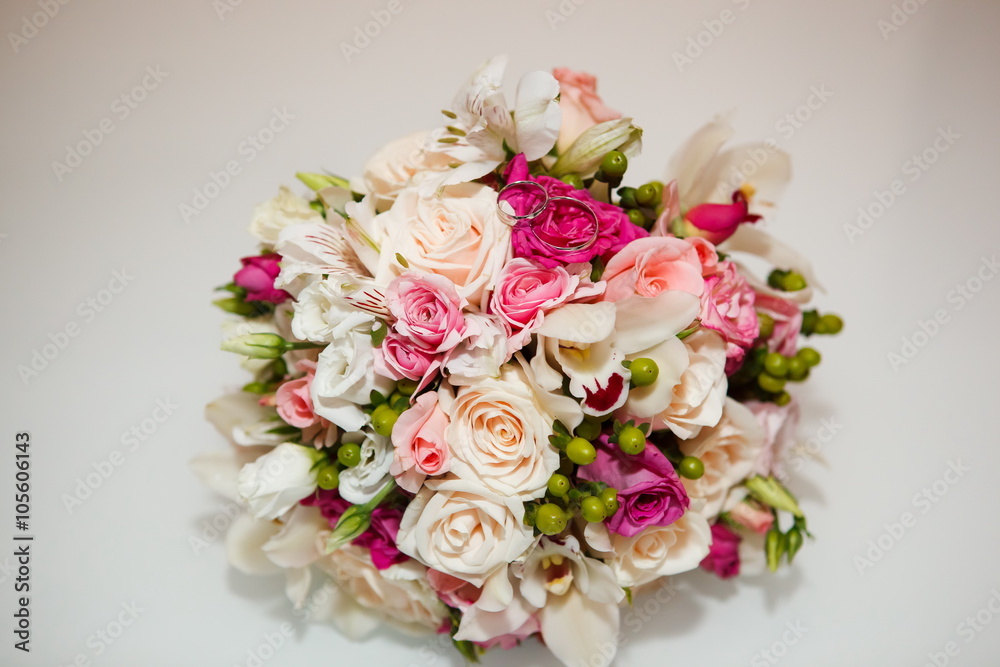 Wedding bouquet and wedding rings close-up