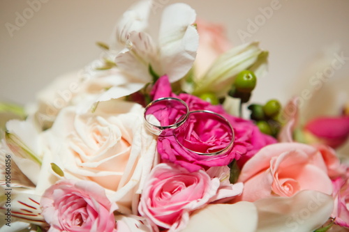 Wedding bouquet and wedding rings close-up