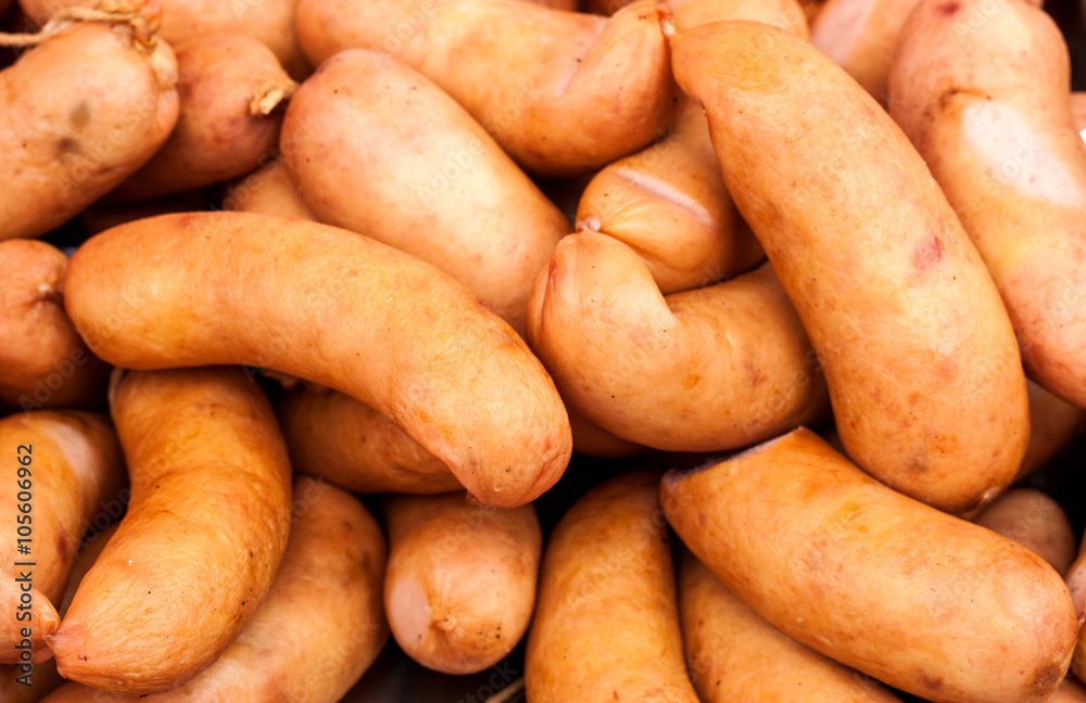 many sausages in natural casing as a background many sausages in natural casing as a background