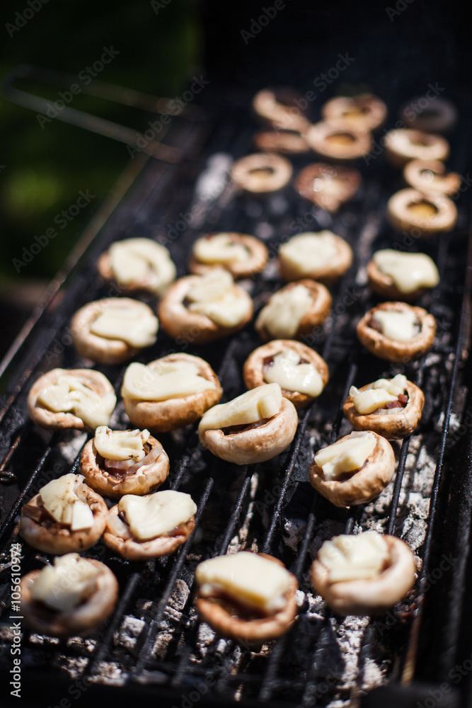 Champignon white mushrooms grilled on grill or BBQ steam Champignon white mushrooms grilled on grill or BBQ steam