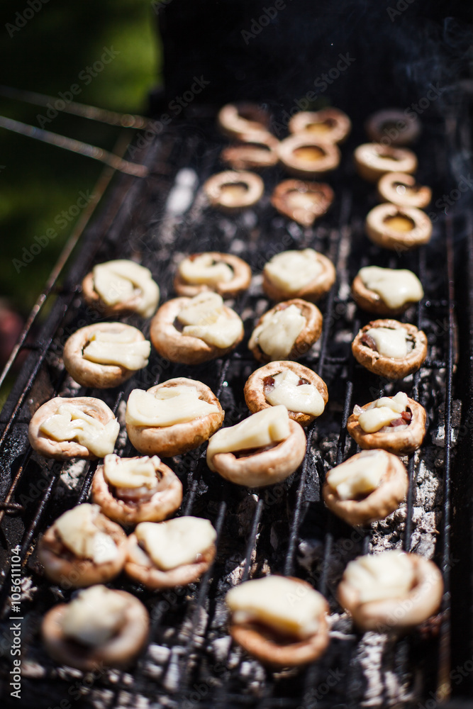 Champignon white mushrooms grilled on grill or BBQ steam Champignon white mushrooms grilled on grill or BBQ steam
