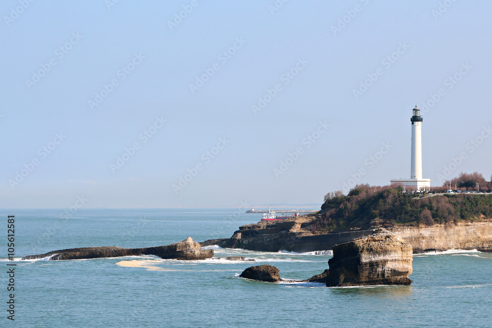 great beach and the center of Biarritz view of the lighthouse in the distance
