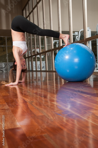 Woman stretching with a ball