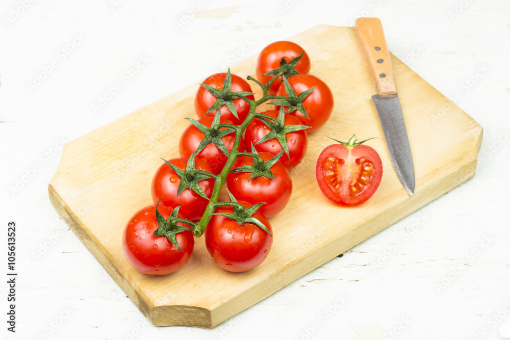 Fresh tomatoes on a wooden table. Fresh tomatoes on a wooden table.