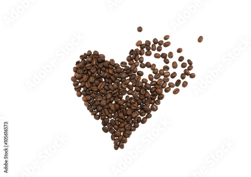 Smashed heart made of coffee beans on white background