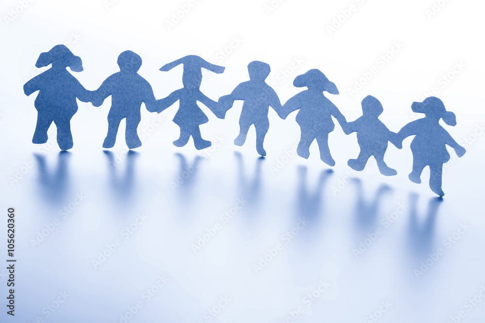 Paper children standing together hand in hand. Paper children standing together hand in hand.