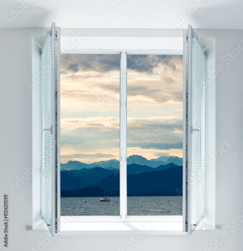 Lake Garda is the largest lake in Italy  seen through the window