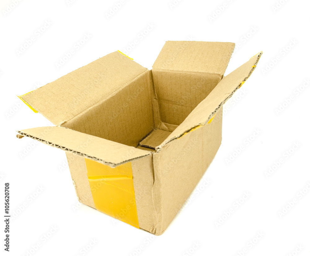 Closed cardboard box taped up with yellow scotch masking tape and isolated on a white background / Cardboard box front side with isolated on white Closed cardboard box taped up with yellow scotch masking tape and isolated on a white background / Cardboard box front side with isolated on white