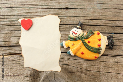 Snowman with red heart love symbol and copy space - valentine's day concept
