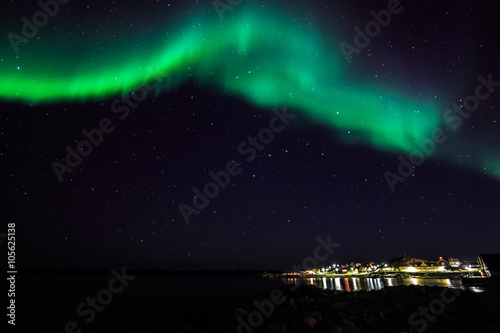 Northern lights over the old harbor of Nuuk city