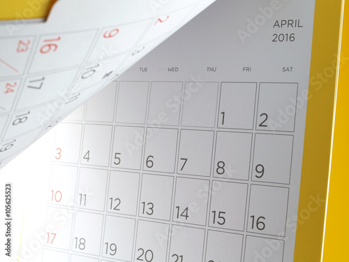 cardboard desk calendar with days and dates of april 2016 in grid and yellow edge, reminder monthly business planning or meeting deadline, turning the calendar page