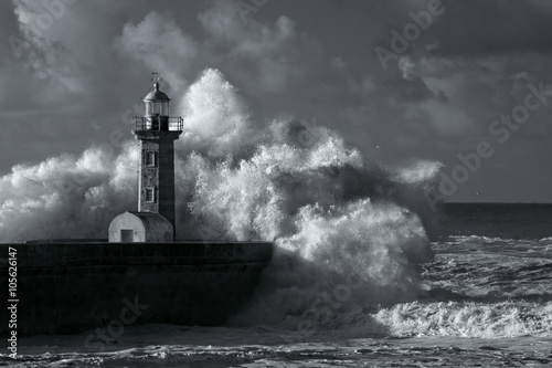 Infrared stormy waves over old lighthouse