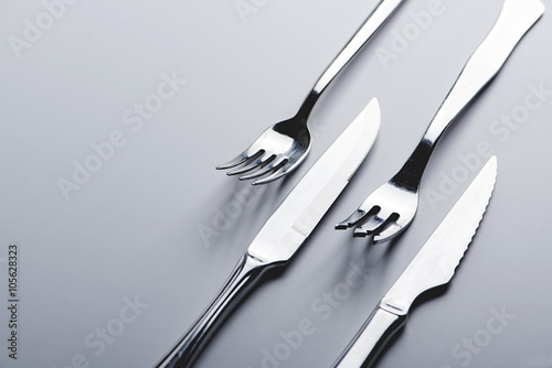 Forks and knives on white background