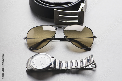 Belt, sunglasses and watch
