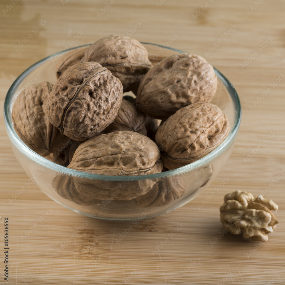 pile of walnuts in the foreground represent a healthy diet pile of walnuts in the foreground represent a healthy diet
