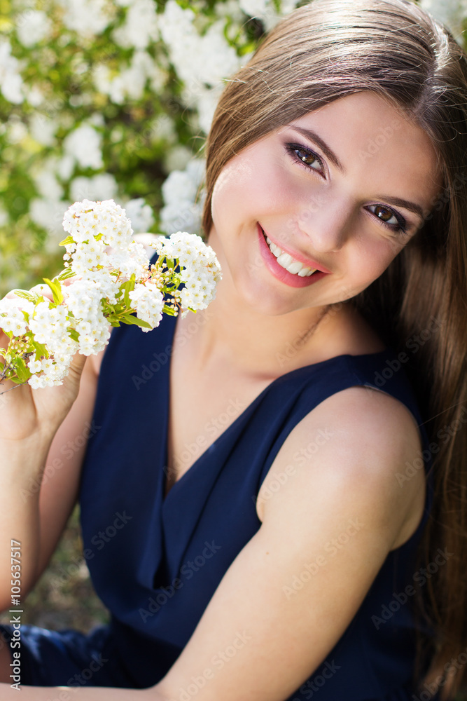 Pretty smiling teen girl with white flowers Pretty smiling teen girl with white flowers