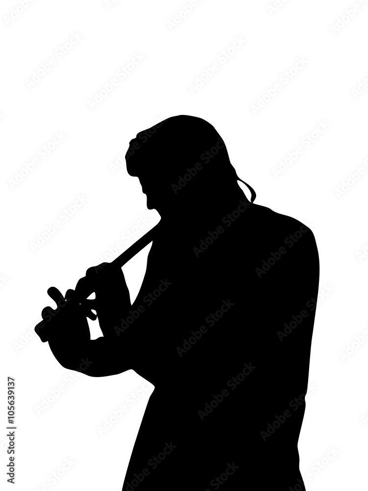 Silhouette playing a flute