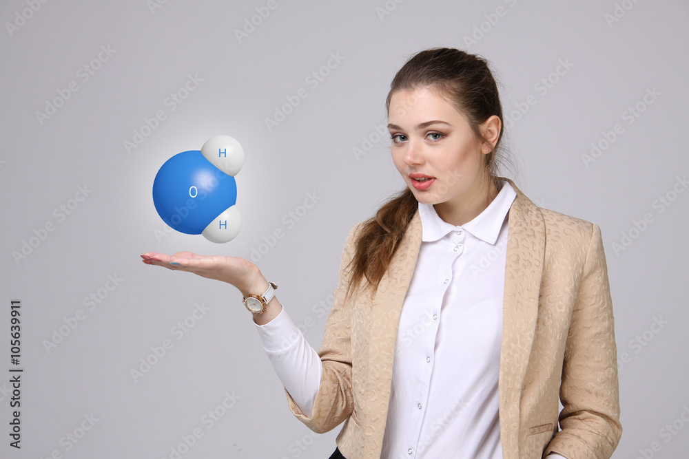 Young woman scientist with model of water molecule. Young woman scientist with model of water molecule.