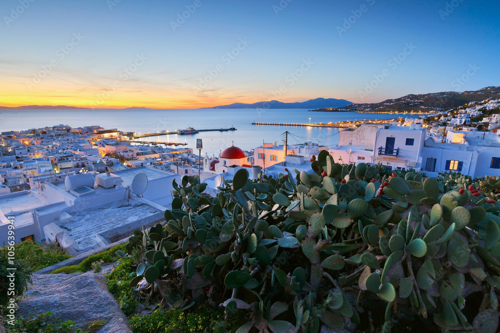 View of Mykonos town and Tinos island in the distance, Greece.