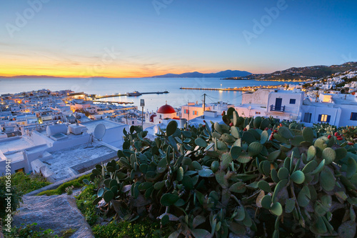 View of Mykonos town and Tinos island in the distance, Greece. photo