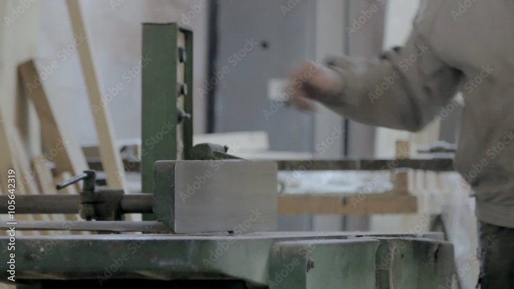 Carpenter working on the planer machine Carpenter working on the planer machine