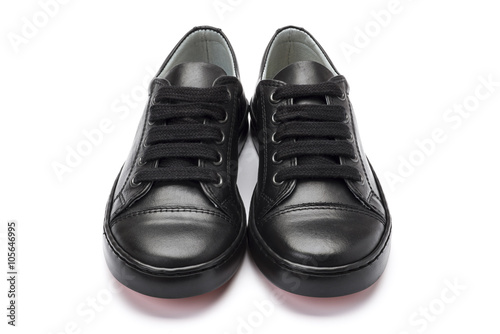 Boys black school shoes on a white background