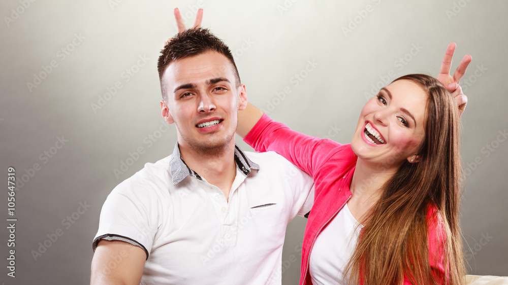 Obraz premium Happy couple having fun and fooling around.